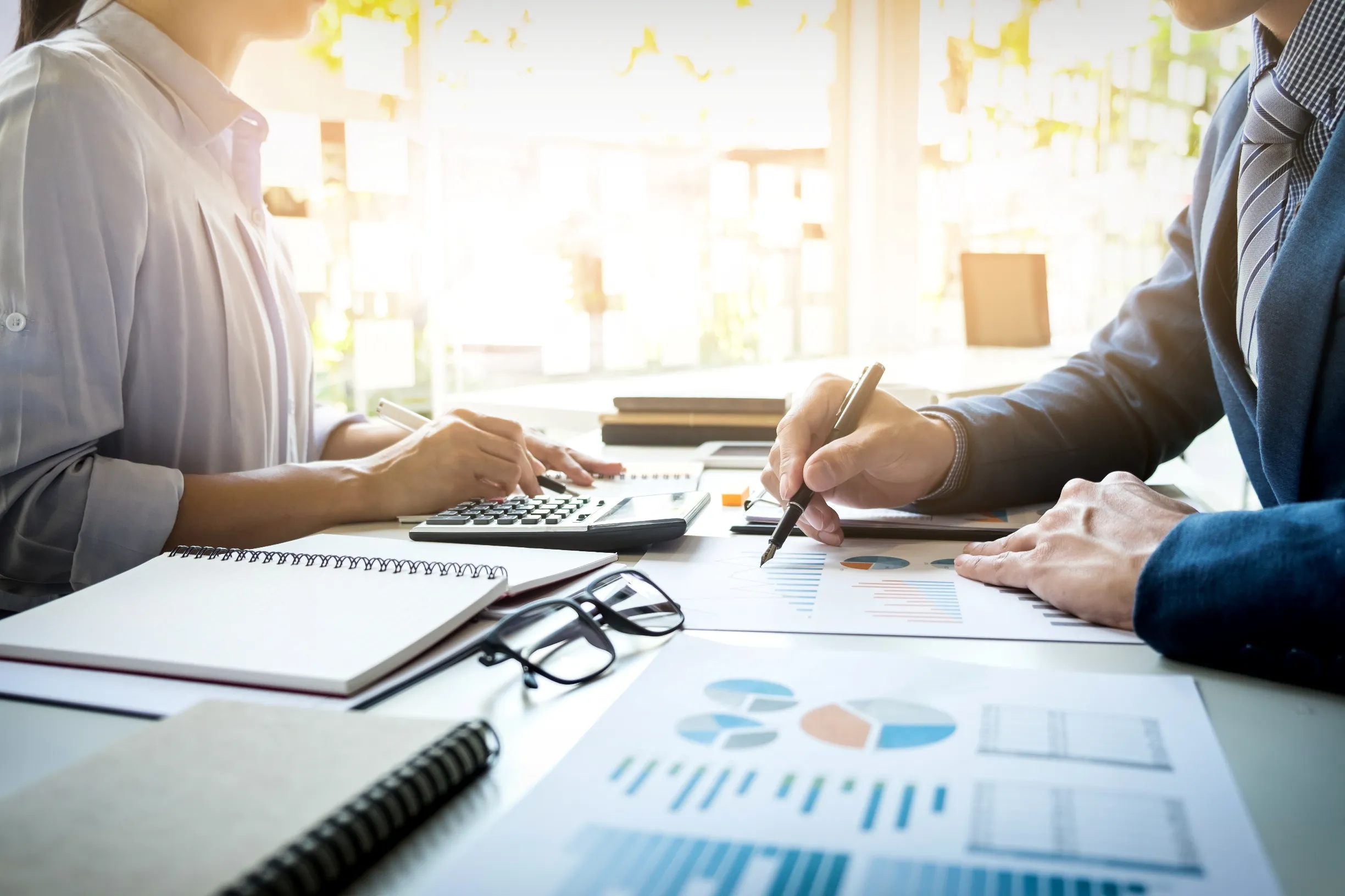 Financial documents and calculator prepared for audit review