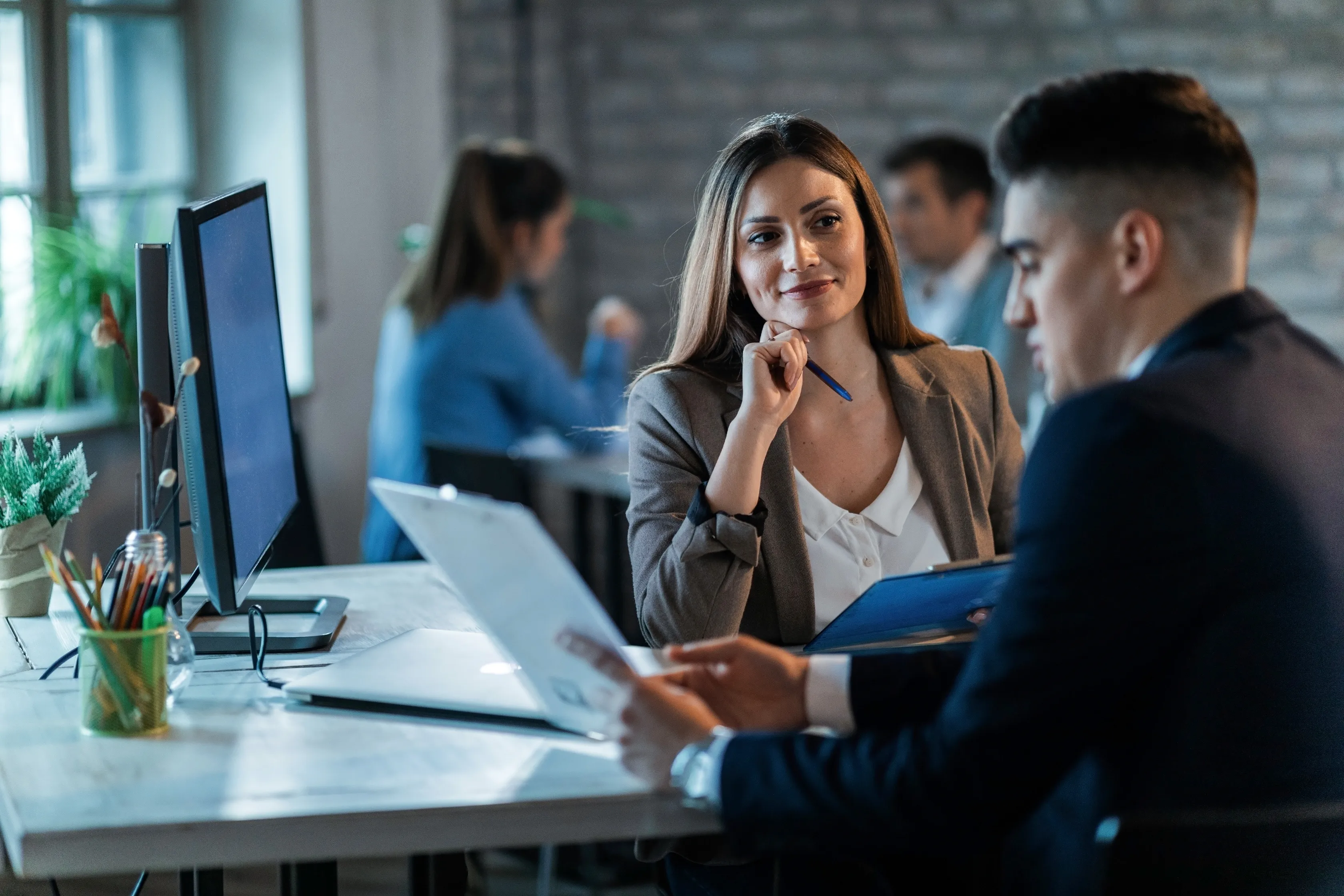 Professional reviewing business information at a desk